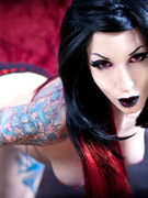 Hot tattooed goth chicks exposing their lusciously formed body.