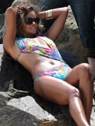 Bodacious claudia jordan posing in a floral swimsuit during the outdoor shoot