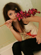 Flower loving sweet young blode girl taking different nice teasy shot with flower