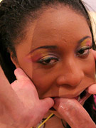 Her ebony face gets covered in spit and semen